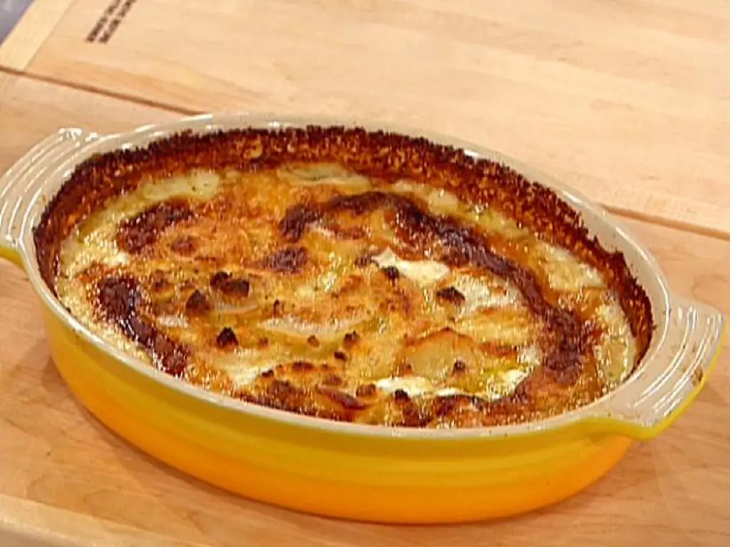 Potato Goat Cheese Gratin is a dish with sliced potatoes, cream and garlic