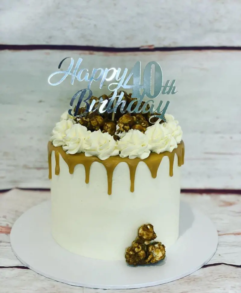 A little mini caramel cake with caramel ganache and buttercream, topped with homemade caramel popcorn