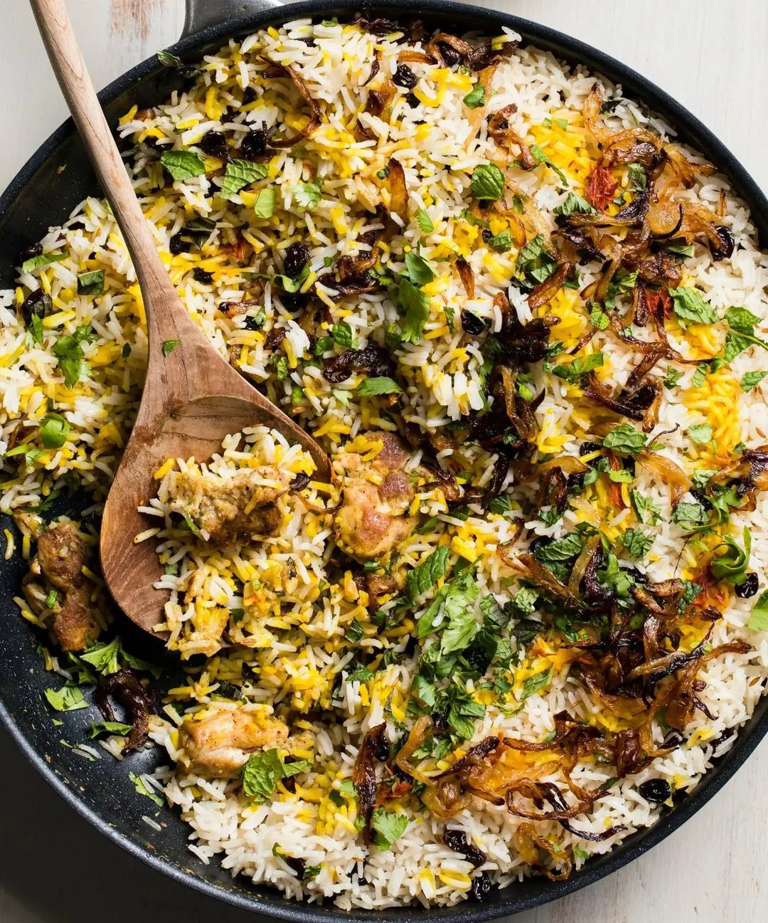 Flavors in a Biryani is balanced by sweet caramelized onions with aromatics and traditional Indian spices