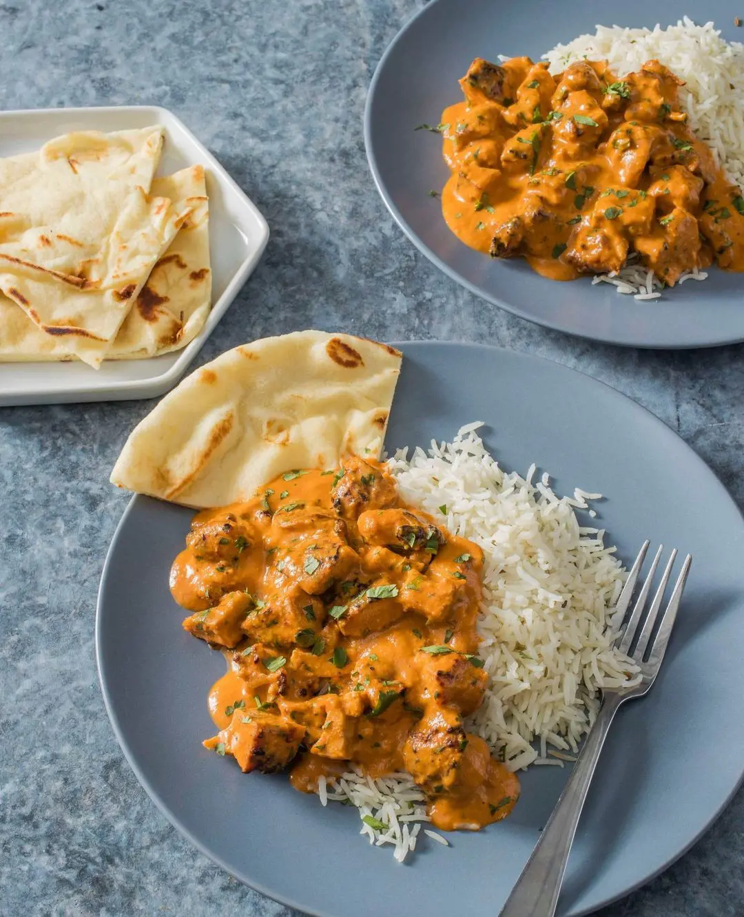 Butter Chicken is often eaten in Northern parts of India with white rice and naan bread