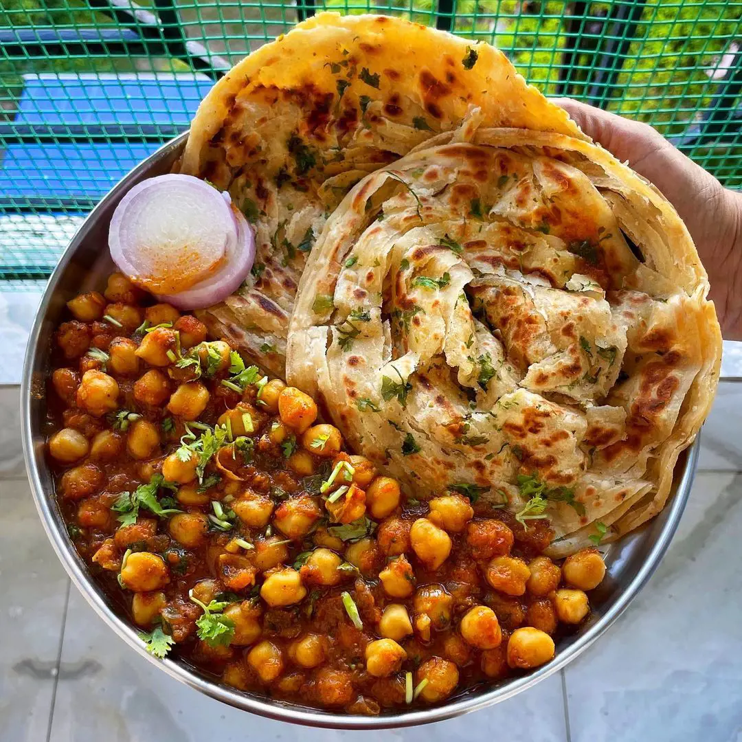 Soaked chickpeas curry with tomatoes, chili and caramelized onions pairs well with a roti or naan