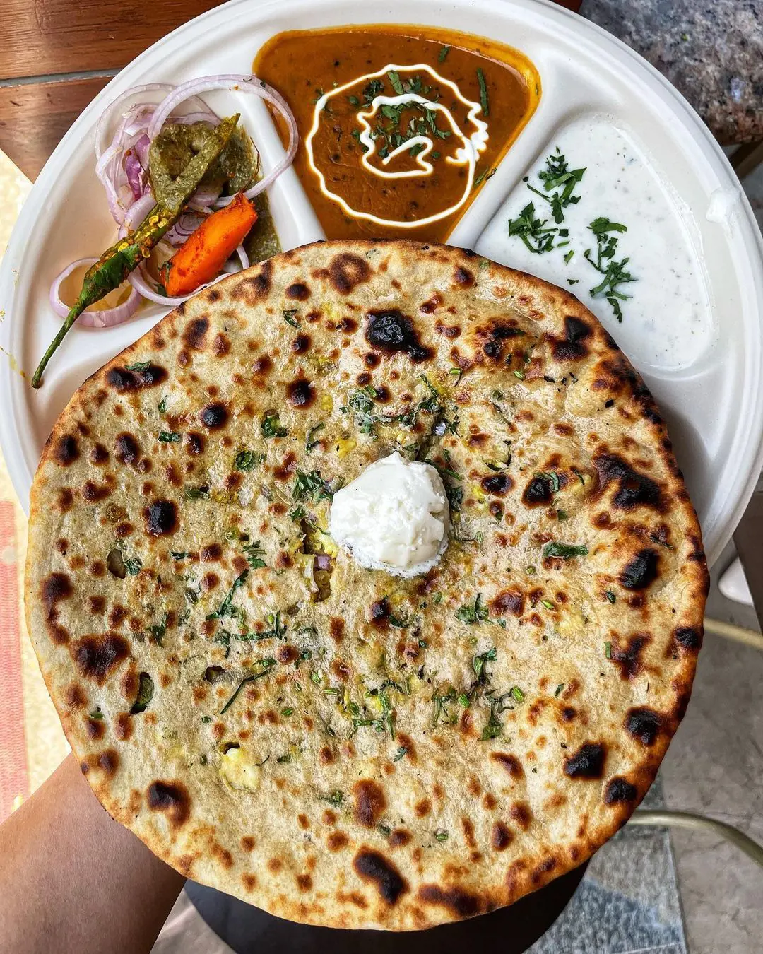 Naan or paratha is made with all purpose flour but you can opt for a healthier option with whole wheat flour