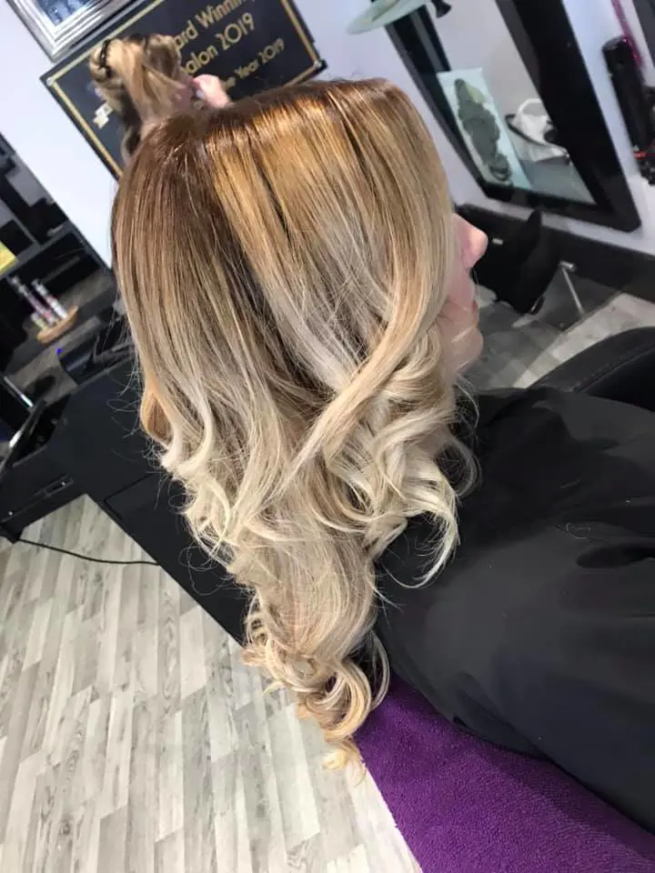 An artfully blended higher blonde, with a root smudge and beautifully toned existing blonde