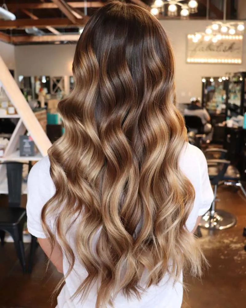 This technique will enhance the silky texture of your hair while showcasing the captivating beauty of your balayage highlights