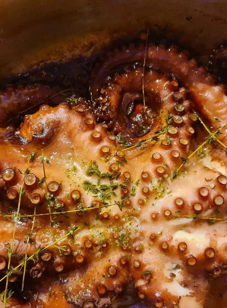 Freshly cooked octopus by Ocean fish platter, which is high in potassium, iron, vitamin B12, and fatty acids
