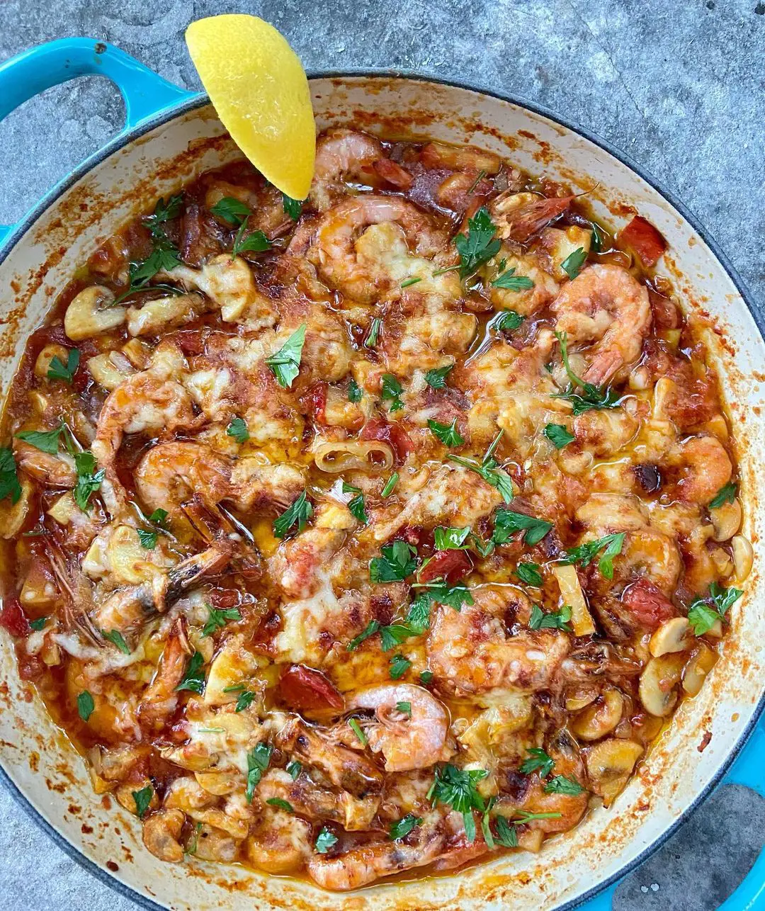 Shrimp casserole is further flavored by okra with cheese and other vegetables