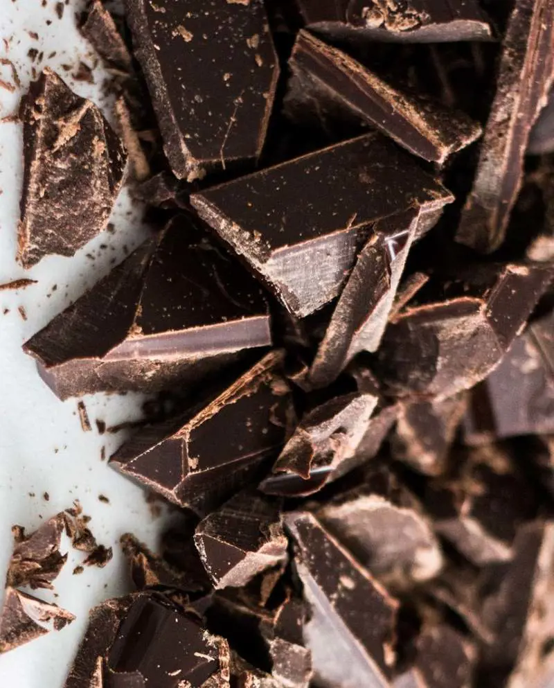 Opt for dark chocolate that's at least 70% cocoa to reap maximum benefits, and limit yourself to a few squares a day
