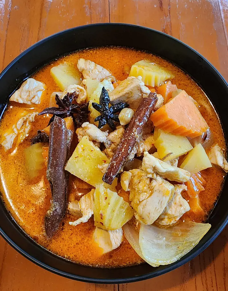 A traditional delicious Massaman chicken curry made with coconut milk from fresh coconuts