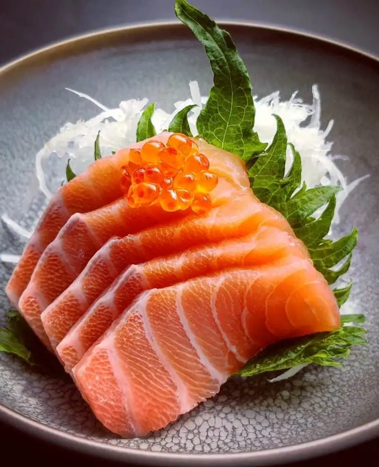 The picture featuring delicious Norwegian salmon sashimi at DOJO Garden Restaurant