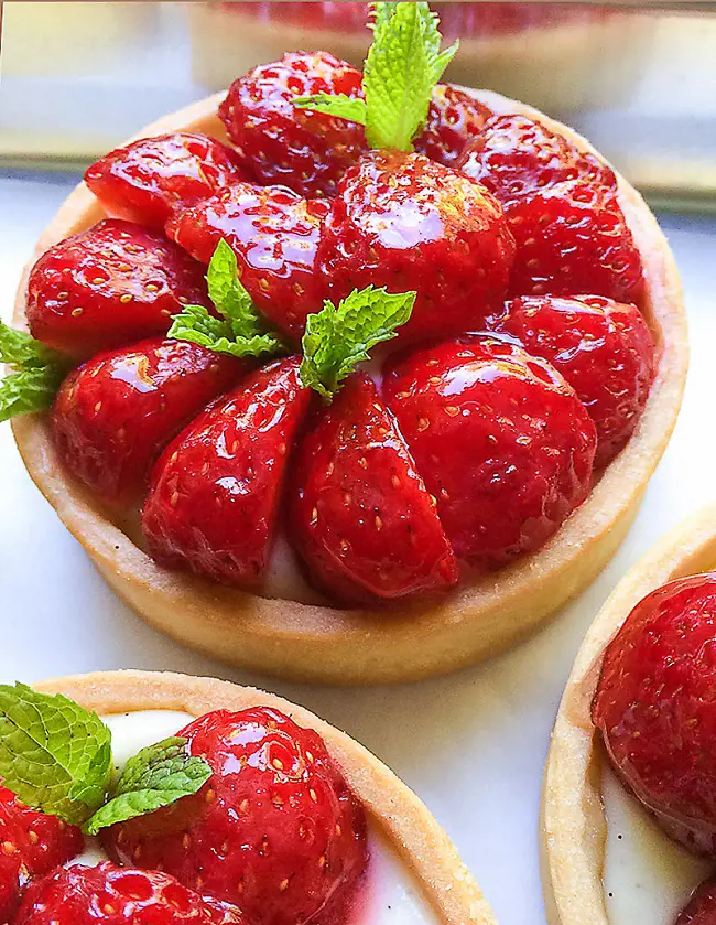 A picture of medium sized delicious strawberry Tart with diplomat cream 