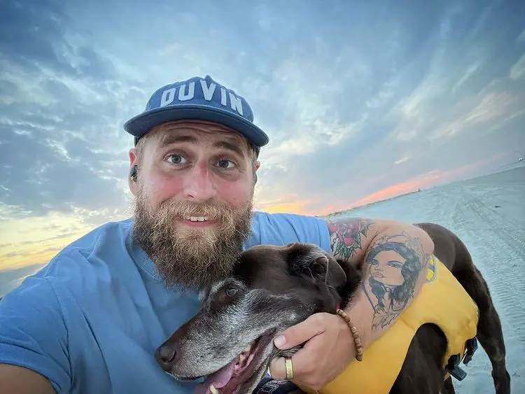 Stamper having a great time with his dog on the beach; he is passionate about helping people become homeowners