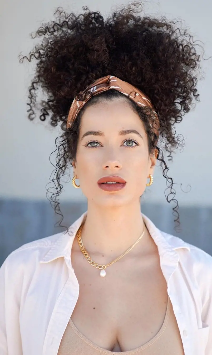 Hortencia styled her hair with Happiness Silk Scarf to complete her curly updo.